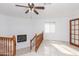 View of living area featuring a charming fireplace and hardwood railings at 14019 N 51St Dr, Glendale, AZ 85306