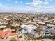 Aerial view of a modern home with pool and surrounding desert landscape at 15008 N Tamarack Ln, Fountain Hills, AZ 85268