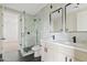 Modern bathroom with a glass shower, double vanity, and dark tile at 15008 N Tamarack Ln, Fountain Hills, AZ 85268