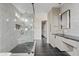 Elegant bathroom features a walk-in shower, freestanding vanity, and dark tile flooring at 15008 N Tamarack Ln, Fountain Hills, AZ 85268