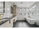 Spa-like bathroom with a soaking tub, double vanity and modern fixtures at 15008 N Tamarack Ln, Fountain Hills, AZ 85268