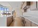 Modern kitchen with island, stainless steel appliances, and light wood cabinets at 15008 N Tamarack Ln, Fountain Hills, AZ 85268