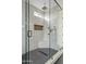 Large walk-in shower with a rain shower head and built-in bench at 15008 N Tamarack Ln, Fountain Hills, AZ 85268