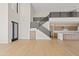 Modern staircase leading to an open loft area and kitchen at 15008 N Tamarack Ln, Fountain Hills, AZ 85268