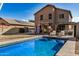 Inviting backyard with sparkling pool, pergola, and patio furniture at 15138 W Fillmore St, Goodyear, AZ 85338