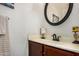 Bathroom features a vanity with a round mirror at 15138 W Fillmore St, Goodyear, AZ 85338