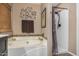 Bathroom with a soaking tub and shower at 15138 W Fillmore St, Goodyear, AZ 85338