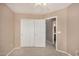 Bright bedroom with double door closet and ceiling fan at 15138 W Fillmore St, Goodyear, AZ 85338