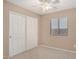 Spacious bedroom with large closet and window coverings at 15138 W Fillmore St, Goodyear, AZ 85338