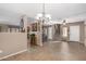 Open dining area with tile floors and views to the living room at 15138 W Fillmore St, Goodyear, AZ 85338