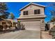 Two-story house with attached garage and landscaping at 15138 W Fillmore St, Goodyear, AZ 85338