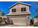 Two-story house with attached garage and landscaping at 15138 W Fillmore St, Goodyear, AZ 85338