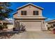 Two-story house with attached garage and landscaping at 15138 W Fillmore St, Goodyear, AZ 85338