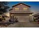 Two-story house with attached garage and landscaping at 15138 W Fillmore St, Goodyear, AZ 85338