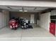 Garage with storage cabinets and two motorcycles at 15138 W Fillmore St, Goodyear, AZ 85338