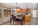 Kitchen with wood cabinetry, granite counters and island at 15138 W Fillmore St, Goodyear, AZ 85338