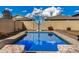 Refreshing blue pool with lounge chairs in a sunny backyard at 15138 W Fillmore St, Goodyear, AZ 85338