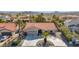 House with tile roof, palm trees, and a long driveway in a neighborhood at 15429 E Palomino Blvd, Fountain Hills, AZ 85268