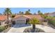 Single-story home with tile roof, palm trees, and a long driveway at 15429 E Palomino Blvd, Fountain Hills, AZ 85268