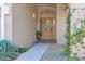 Elegant front entry with a wood door, decorative ironwork, and stone flooring at 15429 E Palomino Blvd, Fountain Hills, AZ 85268