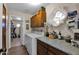 Bright laundry room with washer, dryer, cabinets, and granite countertops at 15429 E Palomino Blvd, Fountain Hills, AZ 85268