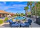 Serene backyard with a pool and fire pit seating area at 15429 E Palomino Blvd, Fountain Hills, AZ 85268