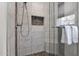 Updated shower with marble tile, glass enclosure, and built-in seat at 15429 E Palomino Blvd, Fountain Hills, AZ 85268