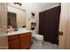 Clean bathroom with shower/tub combo and wood vanity at 15435 N 51St St, Scottsdale, AZ 85254