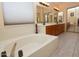 Elegant bathroom with double vanity, large soaking tub, and tile flooring at 15435 N 51St St, Scottsdale, AZ 85254