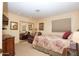 Spacious bedroom with mirrored closet doors and comfortable seating area at 15435 N 51St St, Scottsdale, AZ 85254