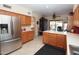 Open kitchen boasts stainless steel appliances and island at 15435 N 51St St, Scottsdale, AZ 85254