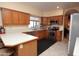 Spacious kitchen with stainless steel appliances and oak cabinets at 15435 N 51St St, Scottsdale, AZ 85254