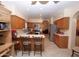 Kitchen with breakfast bar, stainless steel appliances and oak cabinets at 15435 N 51St St, Scottsdale, AZ 85254