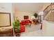 Living room with red leather couches and a grand piano at 15435 N 51St St, Scottsdale, AZ 85254