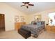 Main bedroom with king-size bed and ensuite bathroom access at 15435 N 51St St, Scottsdale, AZ 85254