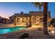 Stunning backyard oasis featuring a pool and patio area at 15725 W Linksview Dr, Surprise, AZ 85374