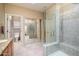 Bathroom features a large walk-in shower and tiled floors at 15725 W Linksview Dr, Surprise, AZ 85374