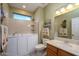 Relaxing bathroom with walk-in shower, soaking tub, and modern vanity at 15725 W Linksview Dr, Surprise, AZ 85374