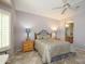 Spacious bedroom with a queen-size bed and ensuite bathroom at 15725 W Linksview Dr, Surprise, AZ 85374