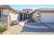 Stone and stucco exterior with a welcoming walkway and two-car garage at 15725 W Linksview Dr, Surprise, AZ 85374