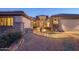 Stone and stucco exterior with a curved walkway leading to the entryway at 15725 W Linksview Dr, Surprise, AZ 85374