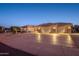 Well-maintained property with a large driveway and desert landscaping at 15725 W Linksview Dr, Surprise, AZ 85374