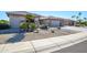 House exterior with desert landscaping and a two-car garage at 15725 W Linksview Dr, Surprise, AZ 85374