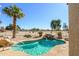 Inviting kidney-shaped pool with waterfall feature and desert landscaping at 15725 W Linksview Dr, Surprise, AZ 85374