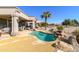 Relaxing pool and patio area with a small waterfall feature at 15725 W Linksview Dr, Surprise, AZ 85374