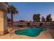 Inviting kidney-shaped pool with a tranquil water feature at 15725 W Linksview Dr, Surprise, AZ 85374