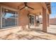 Covered patio with tile flooring and sliding glass door at 15839 W Calavar Rd, Surprise, AZ 85379