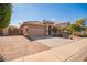 House exterior with a two-car garage and a pathway leading to the entrance at 15839 W Calavar Rd, Surprise, AZ 85379