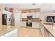 Well-equipped kitchen featuring granite countertops and white cabinets at 15839 W Calavar Rd, Surprise, AZ 85379