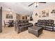 Open living room and dining area with leather seating at 15839 W Calavar Rd, Surprise, AZ 85379